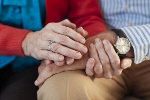 Older adults holding hands