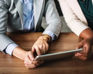 Staff member reviewing a support plan on a tablet